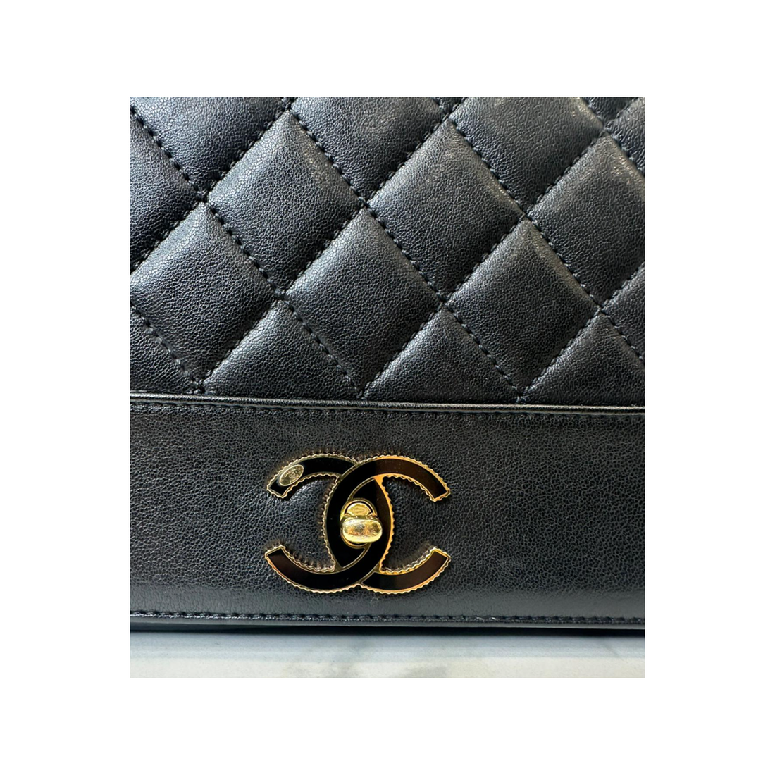 CHANEL DOUBLE FLAP LOGO BADGE IN BLACK